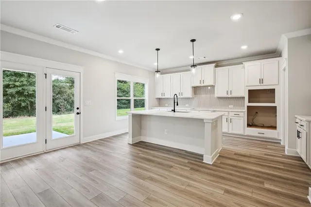 a view of a room with wooden floor and stairs