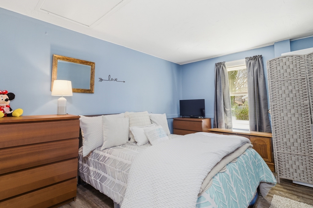 6 Birch Street Wareham, MA 02571 - Photo 14 of 25 a bedroom with a bed and a window