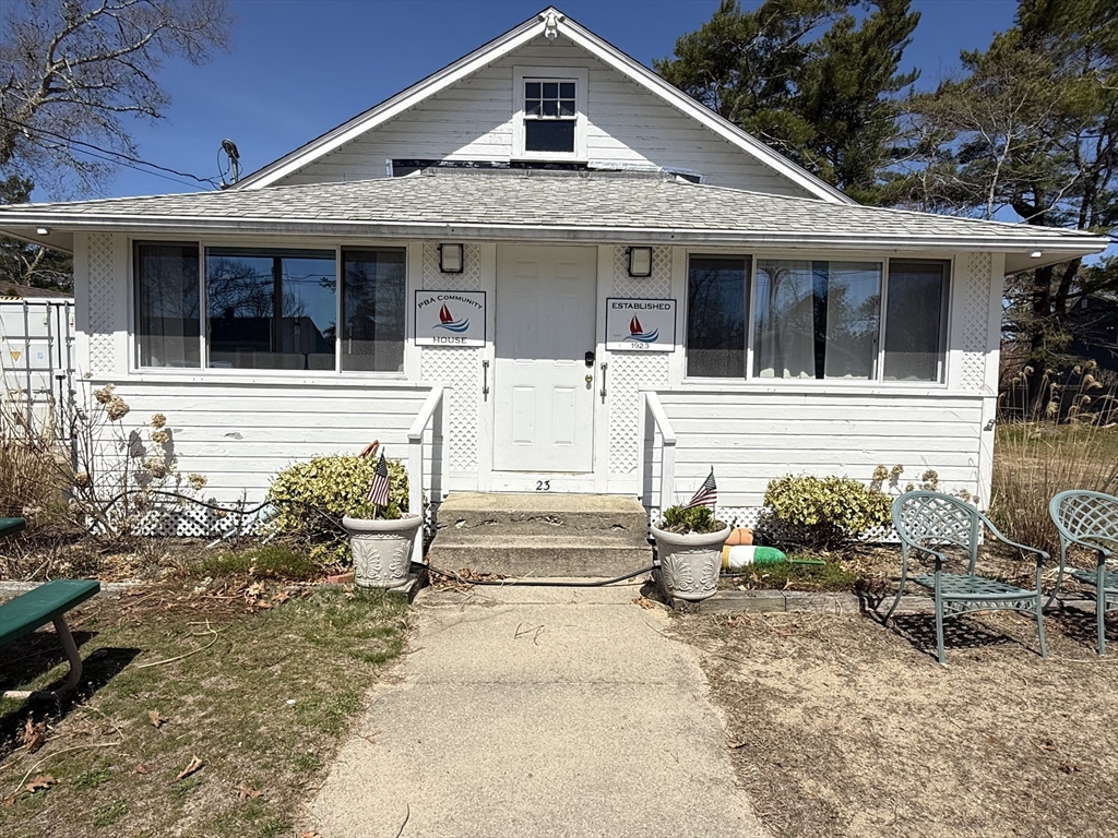 6 Birch Street Wareham, MA 02571 - Photo 25 of 25 a front view of a house with outdoor seating and a potted plant