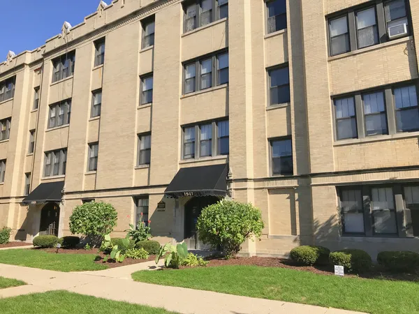 front view of building with a yard