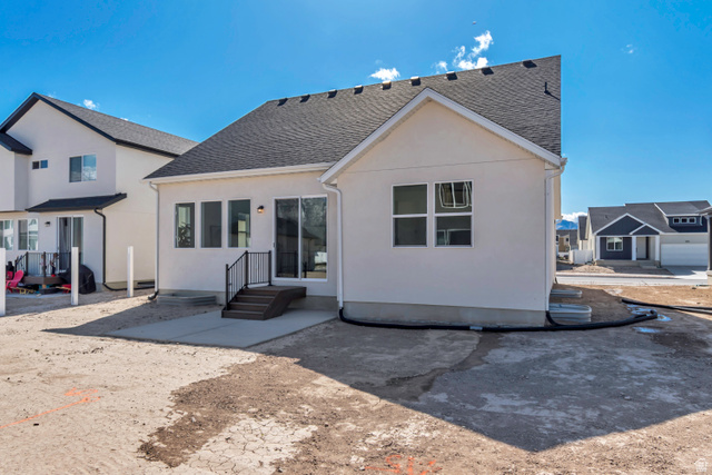 1302 1475 East, Unit 40 Payson, UT 84651 - Photo 32 of 34 Back of house with a shingled roof and stucco siding