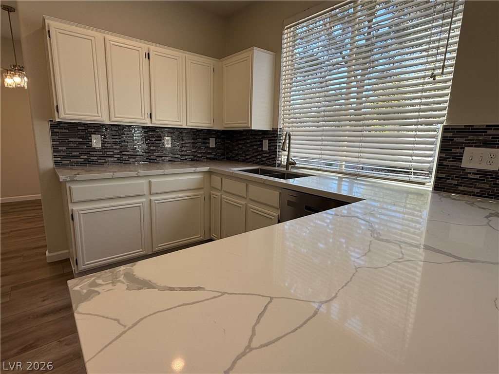 1908 Thunder Ridge Circle Henderson, NV 89012 - Photo 7 of 28 Culinary delights await in this bright kitchen with ample counter space and a sleek modern design.