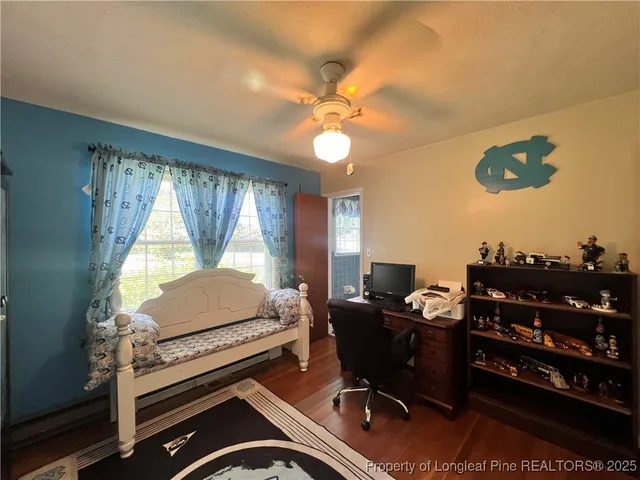 a workspace with furniture and a window