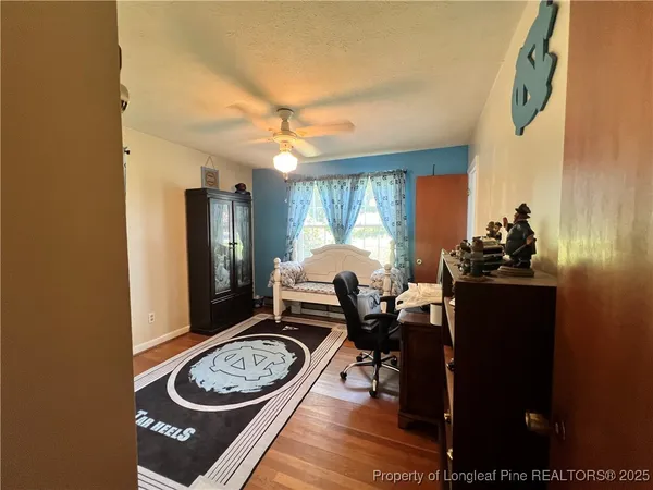 a dining room with furniture and a window