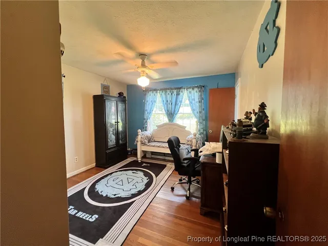 a dining room with furniture and a window