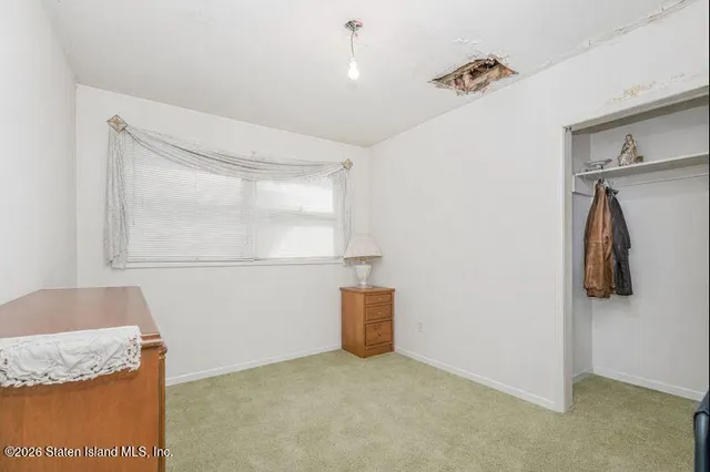 a bathroom with a granite countertop sink and washing machine
