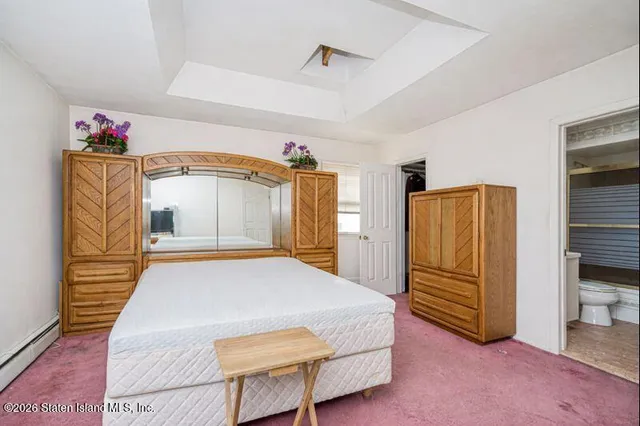 a bedroom with a bed and a closet