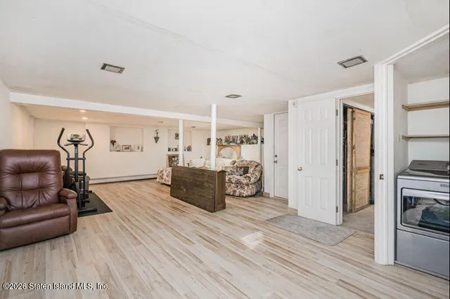 a view of a livingroom with furniture and wooden floor