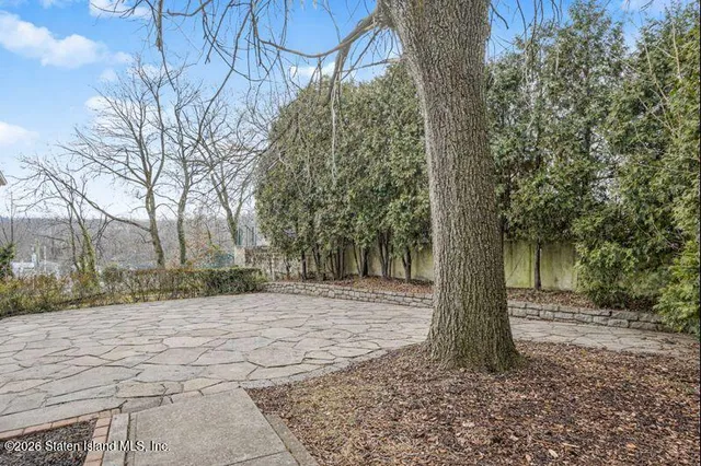 a backyard of a house with lots of green space