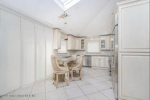 a kitchen with stainless steel appliances cabinets and a counter top space