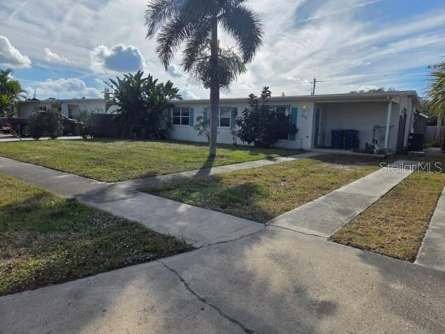 942 Abeto Street Northeast Palm Bay, FL 32905 - Photo 1 of 1 a backyard of a house with lots of green space