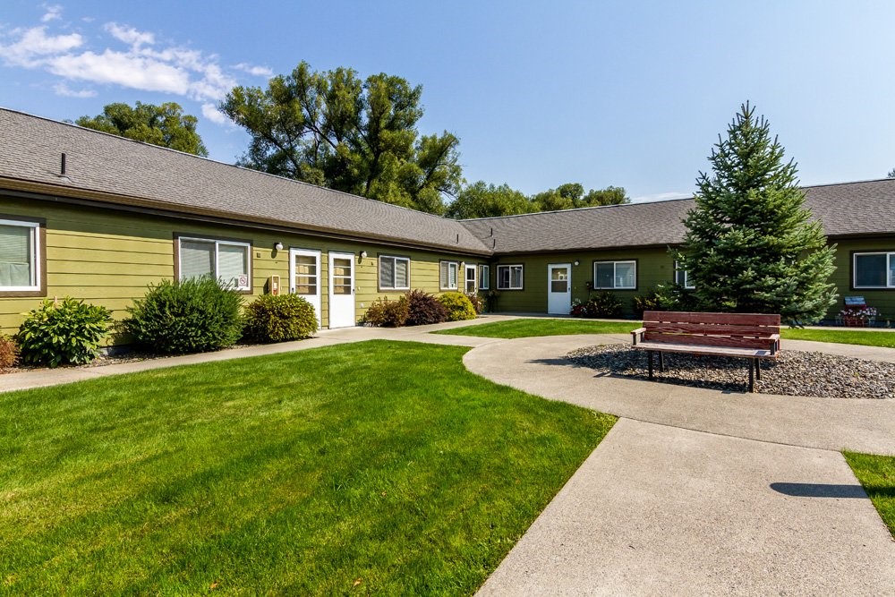 207 North Storie Street Wallowa, OR 97885 - Photo 3 of 9 a house view with swimming pool and garden space