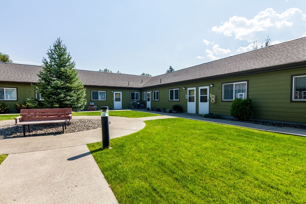 207 North Storie Street Wallowa, OR 97885 - Photo 4 of 9 a view of a house with a yard patio and swimming pool
