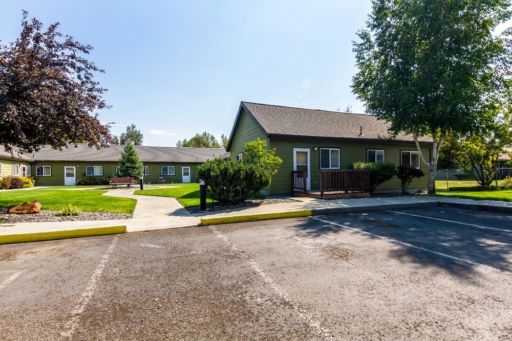 207 North Storie Street Wallowa, OR 97885 - Photo 5 of 9 a view of a swimming pool and trees in the background