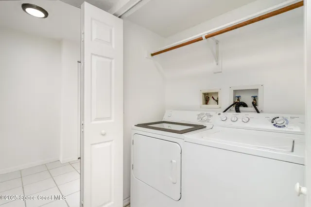 a view of a patio with a table chairs and a table