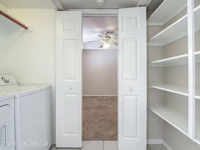 an aerial view of a house with a yard and garden