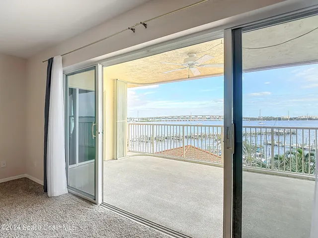 a large white kitchen with cabinets and stainless steel appliances