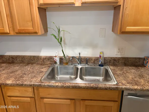 a kitchen with granite countertop a sink and a granite counter tops