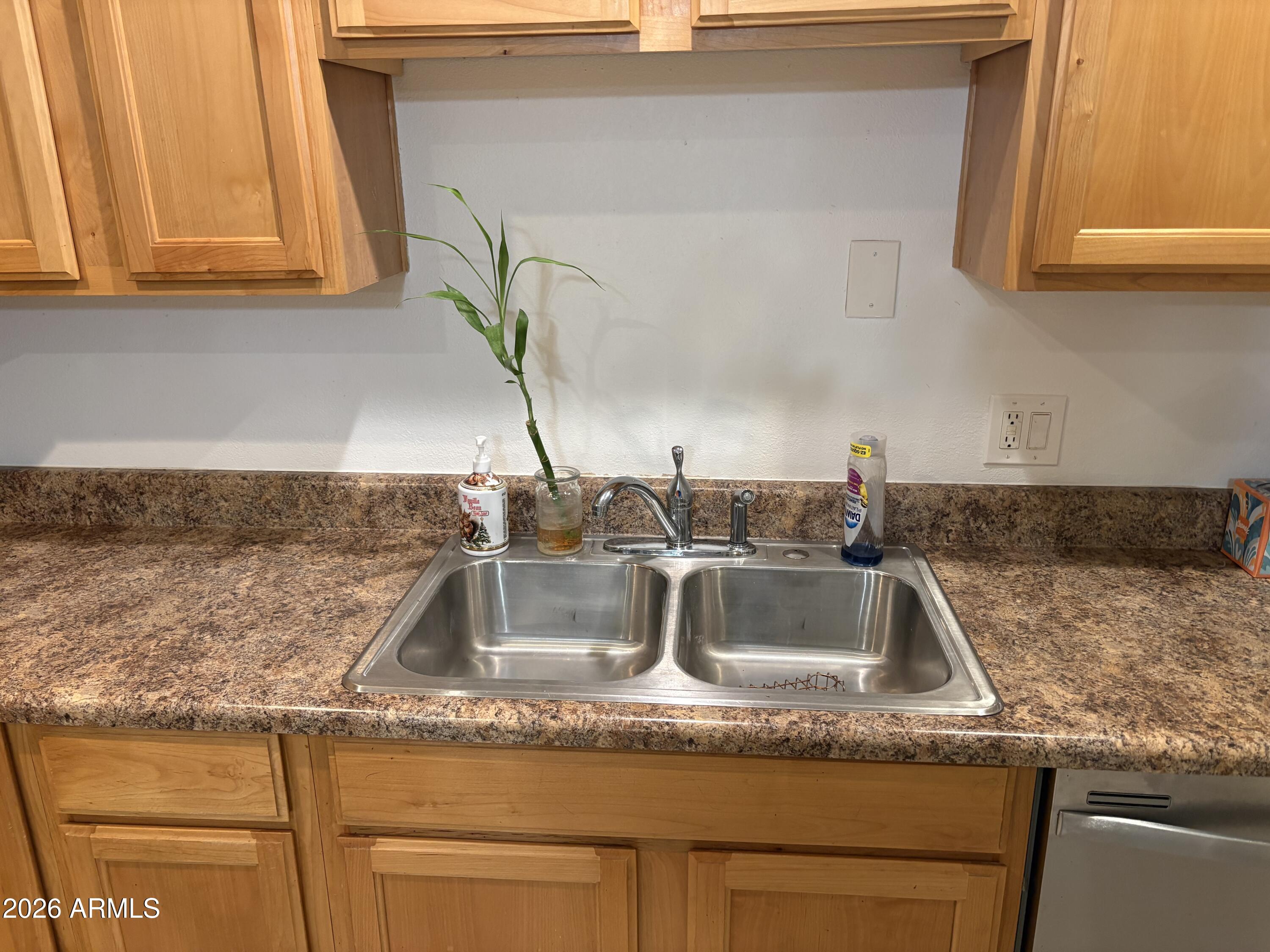 5525 East Thomas Road, Unit A2 Phoenix, AZ 85018 - Photo 2 of 11 a kitchen with granite countertop a sink and a granite counter tops