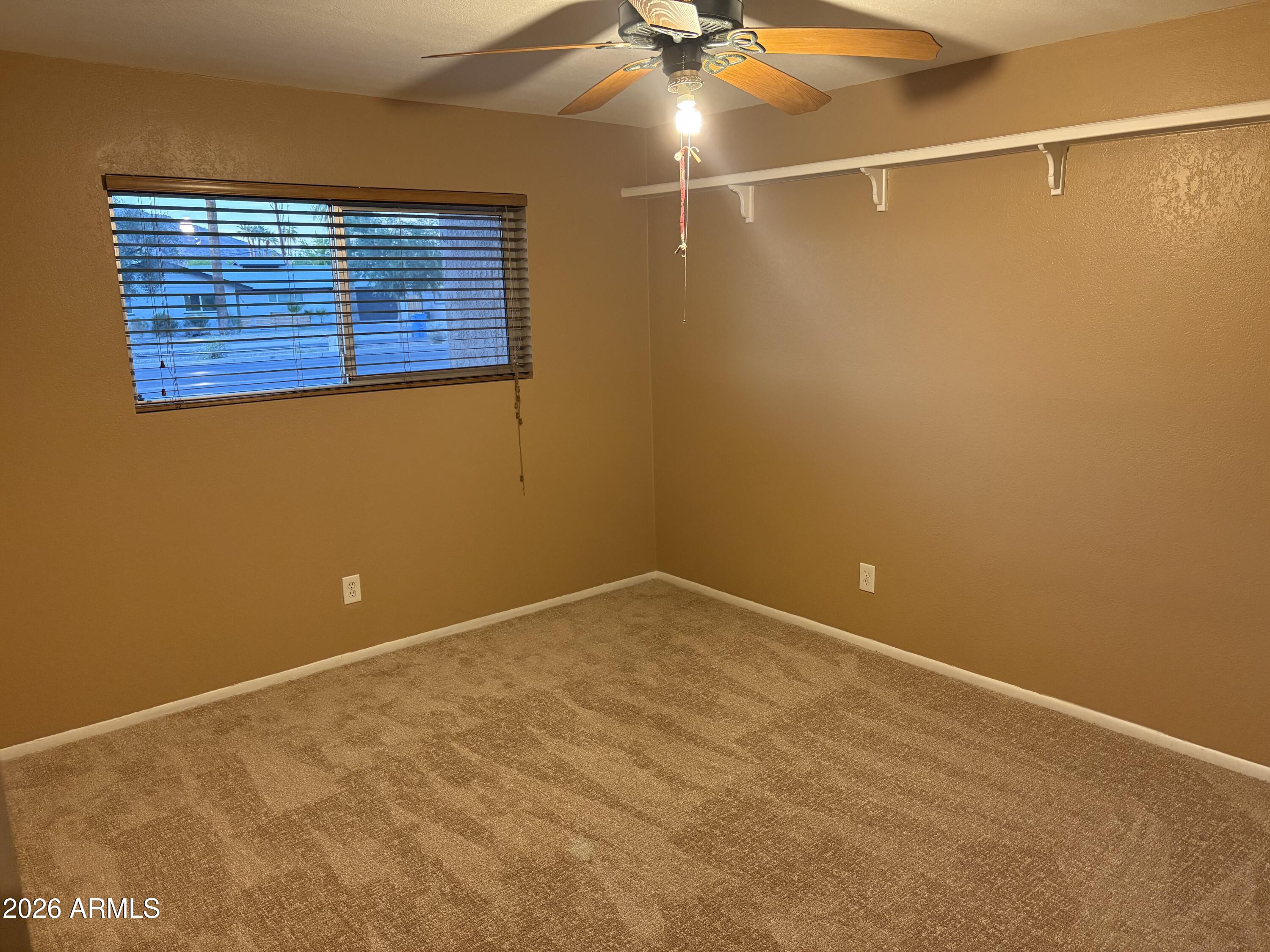 5525 East Thomas Road, Unit A2 Phoenix, AZ 85018 - Photo 4 of 11 a view of an empty room with a window