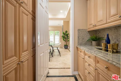 a view of a kitchen with furniture and a window