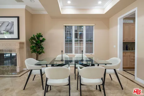 a dining room with furniture and window