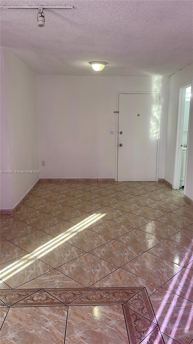 4801 Northwest 7th Street, Unit 70316 Miami, FL 33126 - Photo 2 of 9 a view of a big room with wooden floor