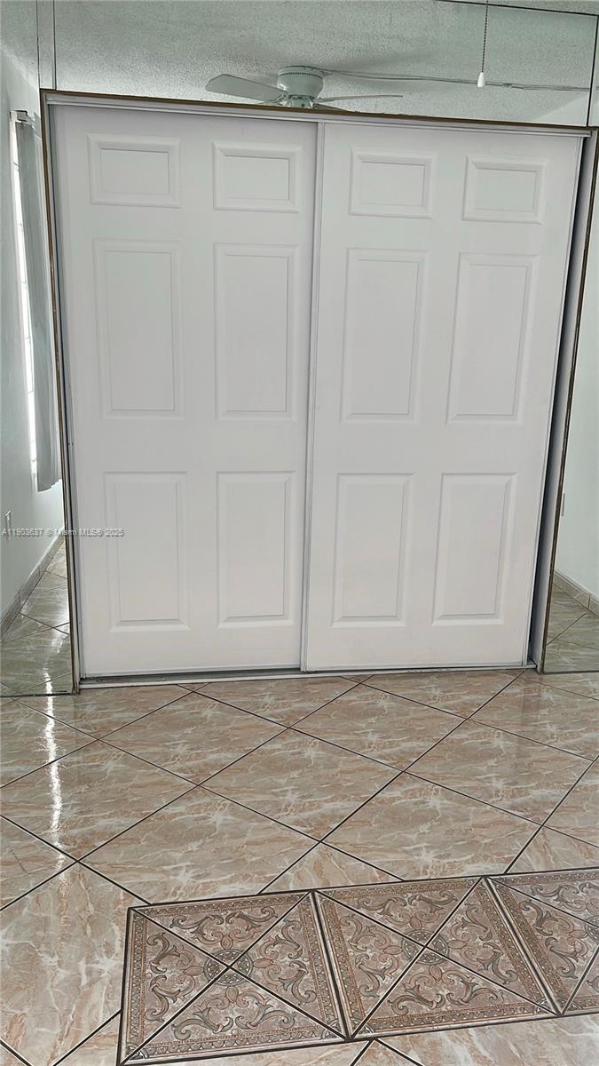 4801 Northwest 7th Street, Unit 70316 Miami, FL 33126 - Photo 8 of 9 a view of wooden door