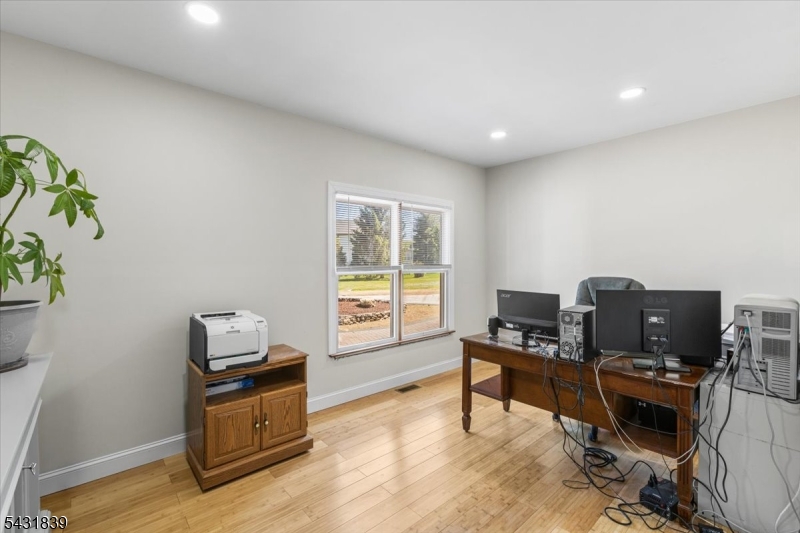 15 Spring Hunter Court Andover, NJ 07821 - Photo 27 of 49 a living room with furniture and a flat screen tv