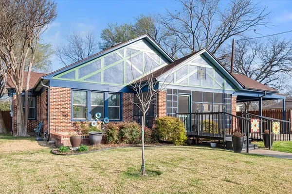 a view of a house with a yard outdoor space and seating area