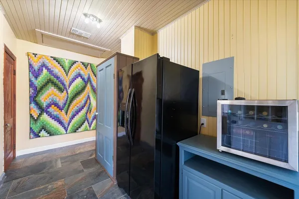 a room with pool table and windows