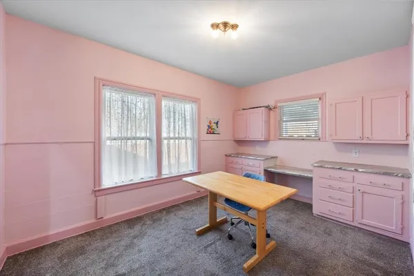 a kitchen with a appliances a sink and a cabinets