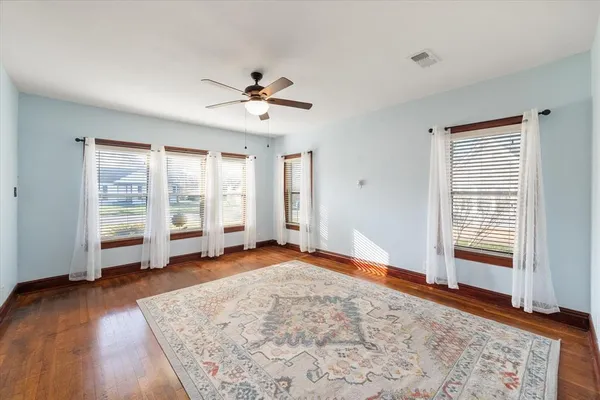 a view of bathroom with a small tub and shower