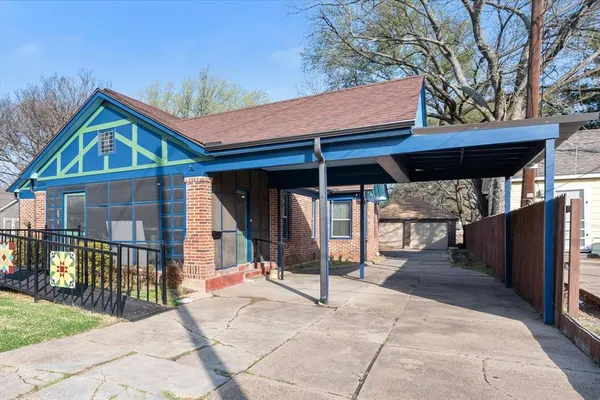 a bedroom with a large bed and a large window