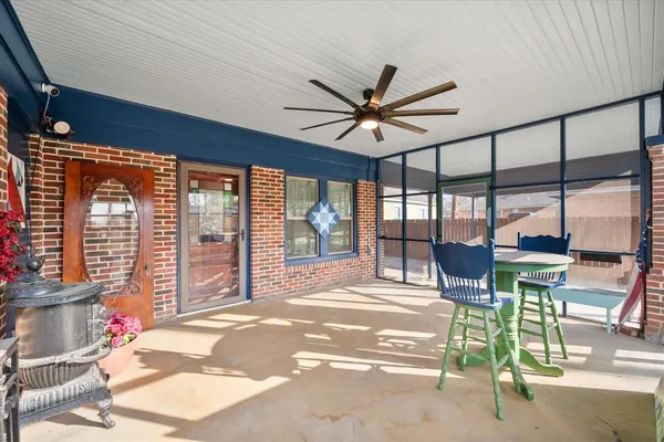 a living room with furniture fireplace and wooden floor