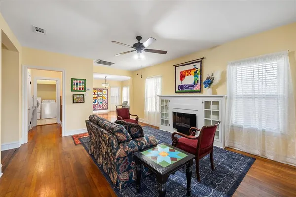 a living room with furniture and a fireplace