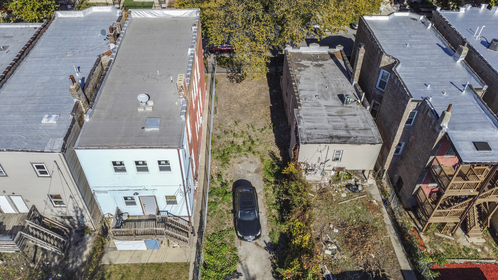 3041 West Flournoy Street Chicago, IL 60612 - Photo 3 of 6 an aerial view of a house with outdoor space