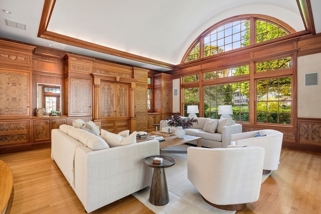 56 Ledgeways Wellesley, MA 02481 - Photo 20 of 42 a living room with furniture a chandelier and a large window