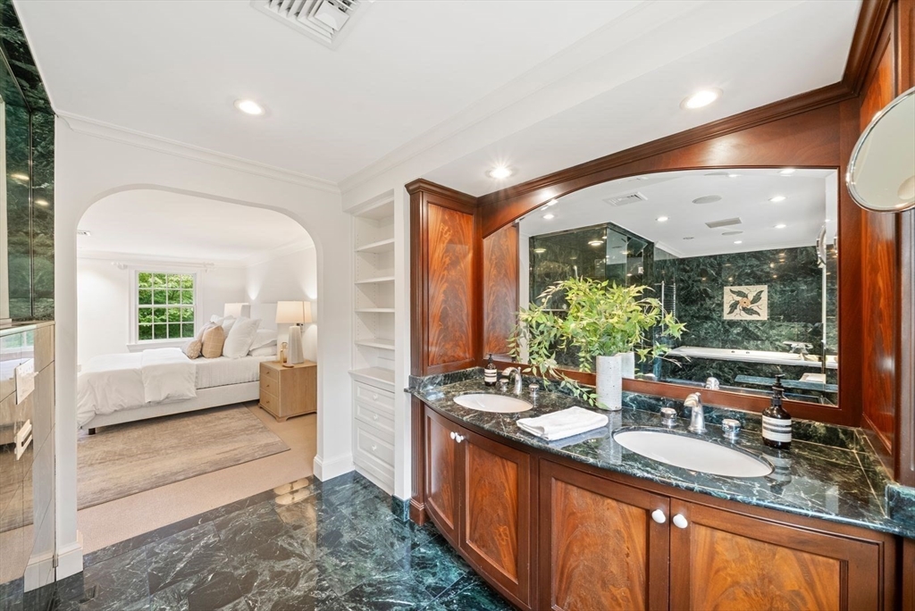 56 Ledgeways Wellesley, MA 02481 - Photo 26 of 42 a large living room with large windows and a rug