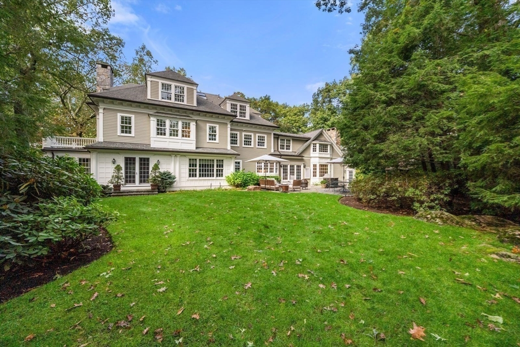 56 Ledgeways Wellesley, MA 02481 - Photo 42 of 42 a front view of a house with a yard table and chairs