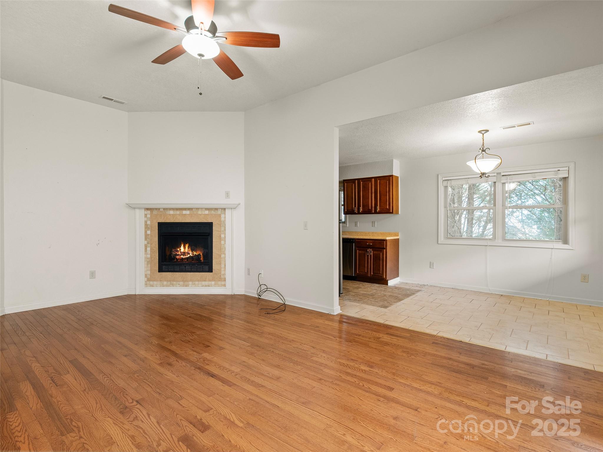 83 Indian Trace Road Maggie Valley, NC 28751 - Photo 8 of 21 an empty room with windows and fireplace