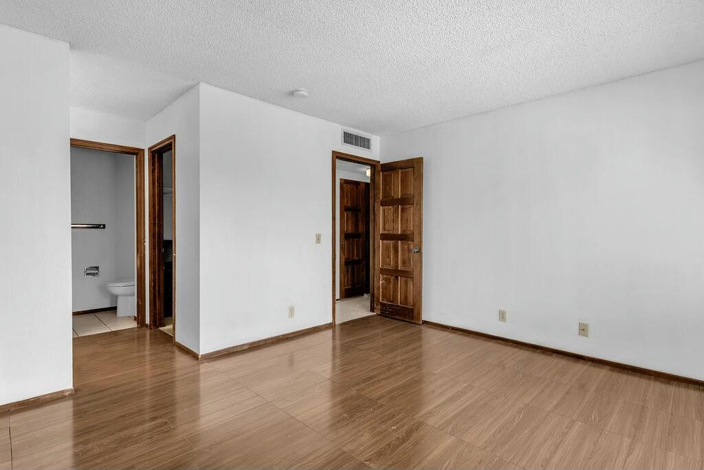 69527 Huerta Court Rancho Mirage, CA 92270 - Photo 11 of 22 an empty room with wooden floor and closet