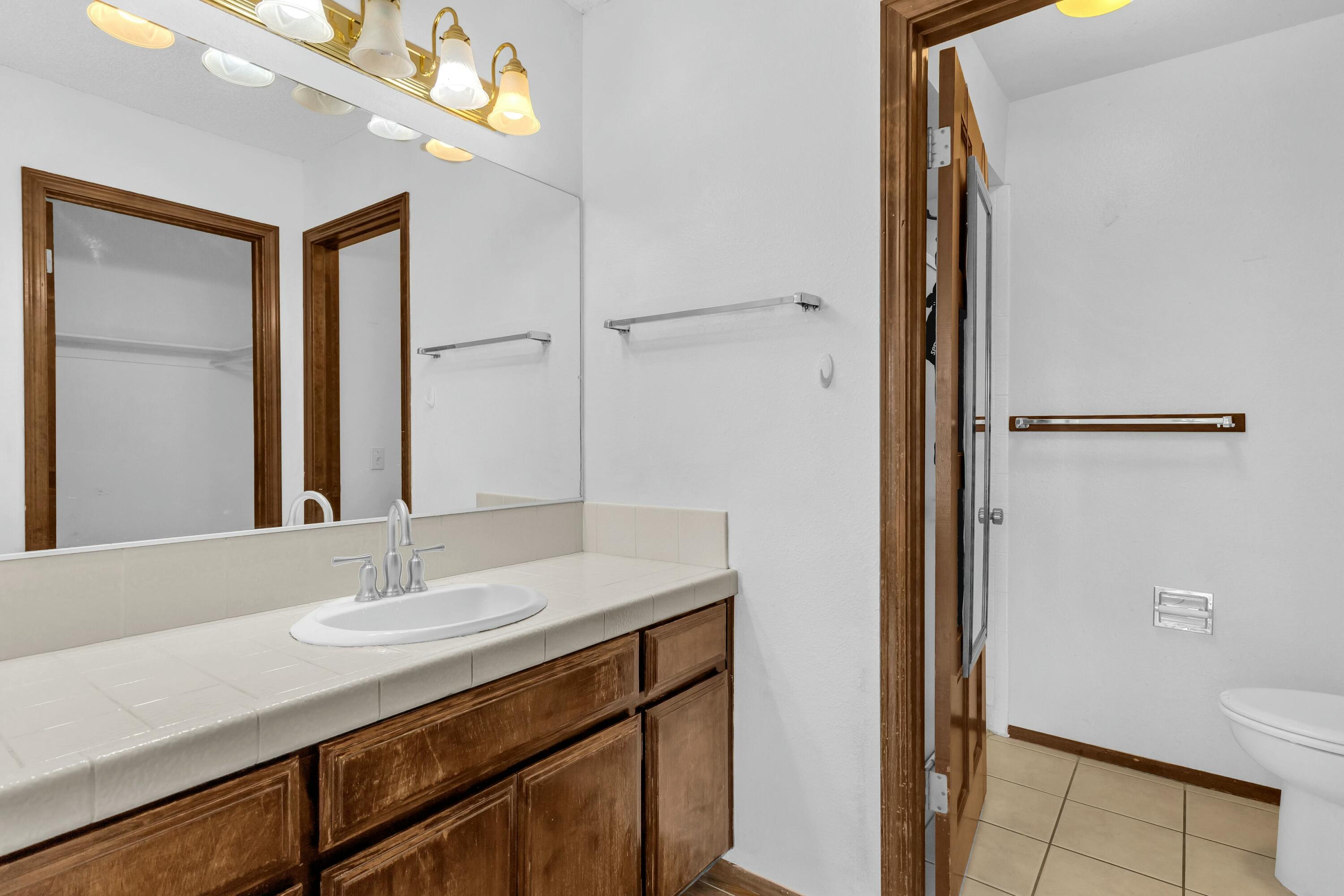 69527 Huerta Court Rancho Mirage, CA 92270 - Photo 12 of 22 a bathroom with a sink and a mirror