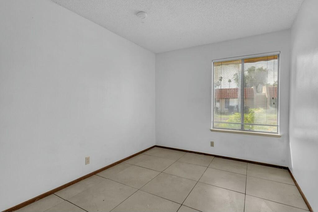 69527 Huerta Court Rancho Mirage, CA 92270 - Photo 14 of 22 an empty room with windows