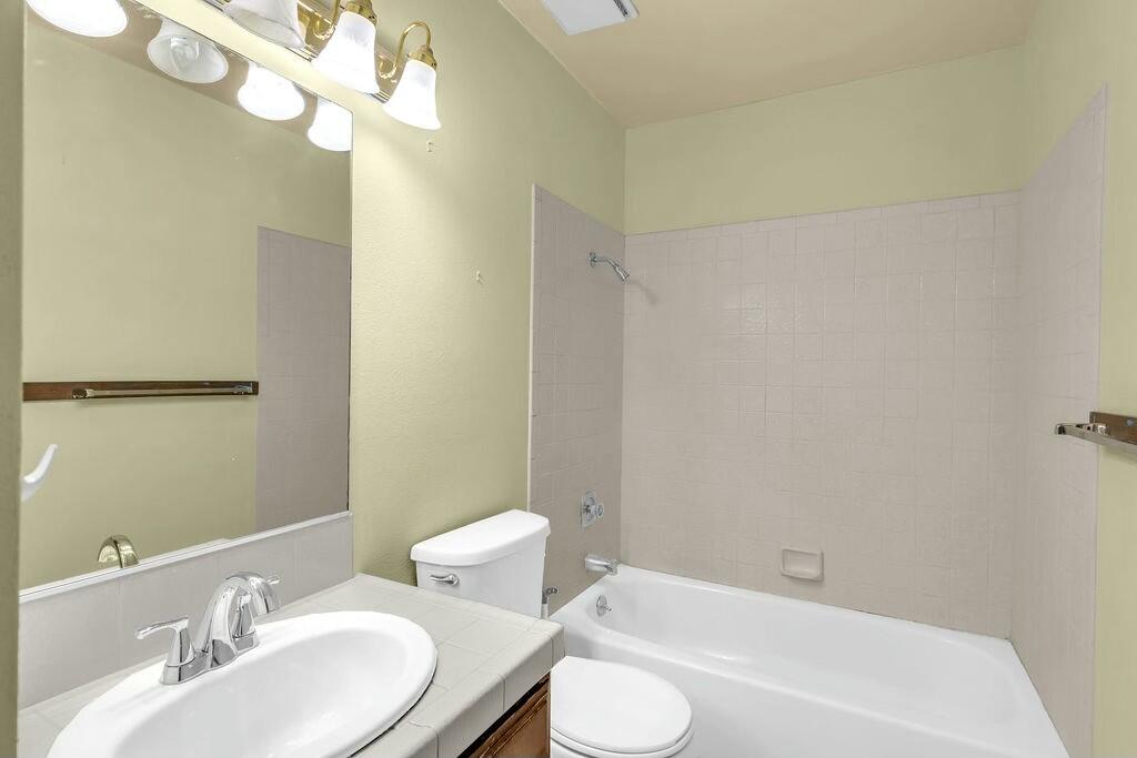 69527 Huerta Court Rancho Mirage, CA 92270 - Photo 15 of 22 a bathroom with a sink a toilet and shower