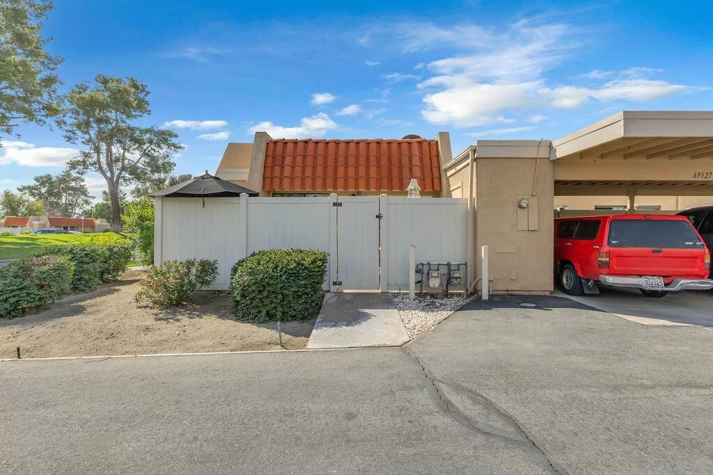 69527 Huerta Court Rancho Mirage, CA 92270 - Photo 19 of 22 a view of a car is parked in front of a house