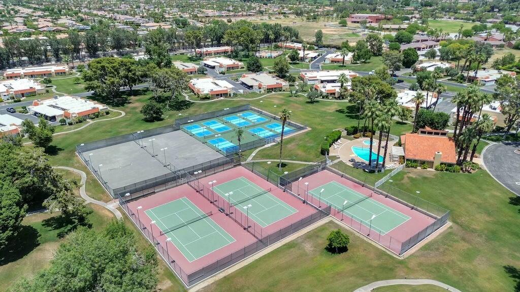 69527 Huerta Court Rancho Mirage, CA 92270 - Photo 22 of 22 an aerial view of a tennis ground and a cars park side of the road