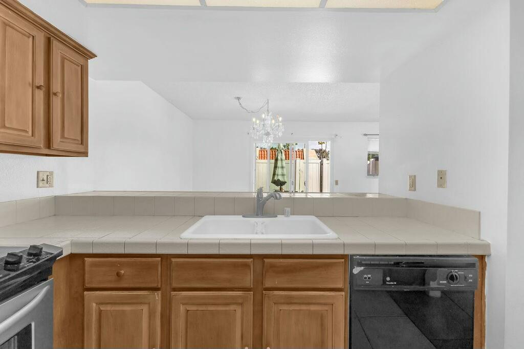 69527 Huerta Court Rancho Mirage, CA 92270 - Photo 10 of 22 a kitchen with a sink and cabinets