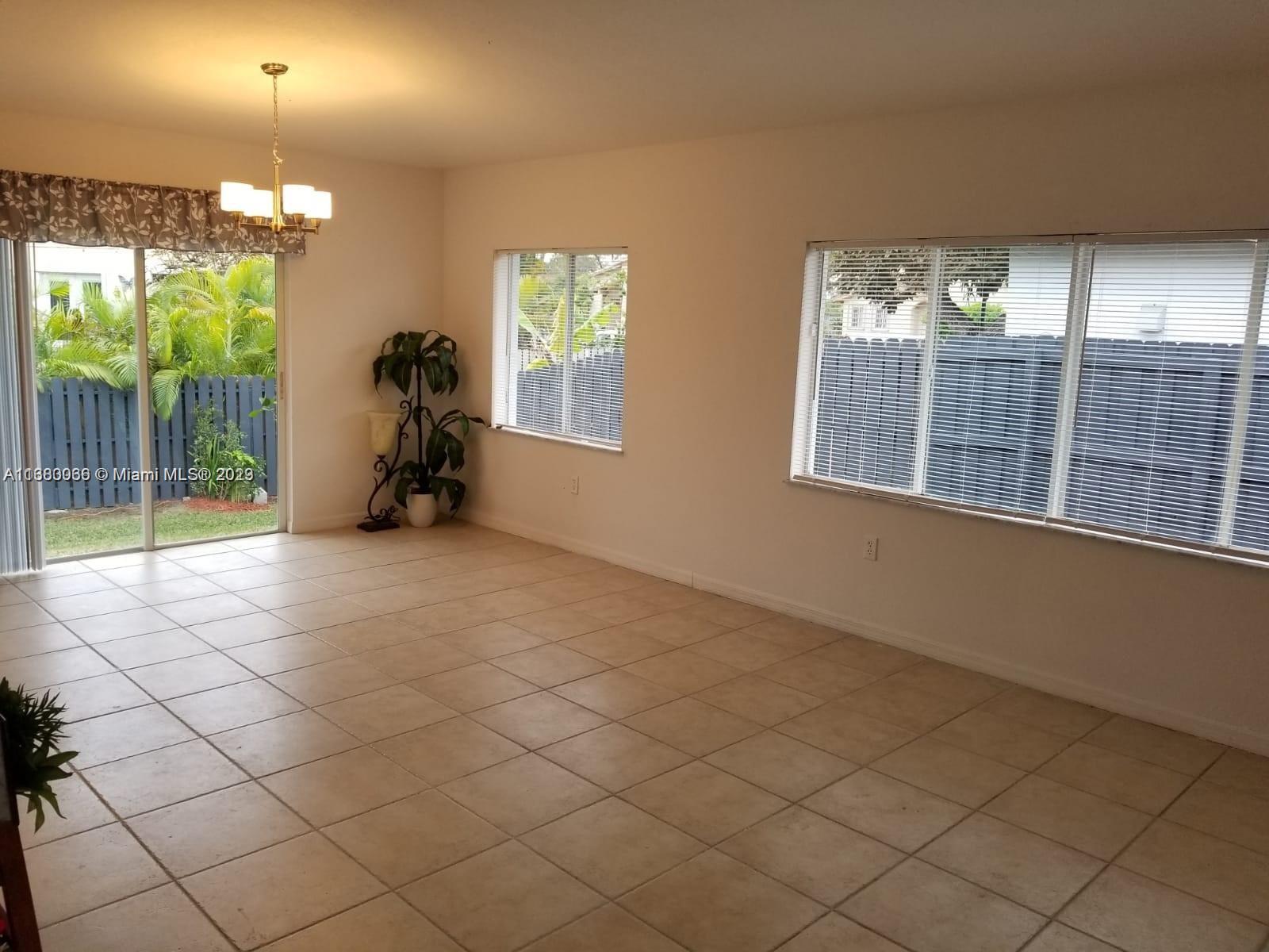 13622 Southwest 285th Terrace Homestead, FL 33033 - Photo 15 of 28 an empty room with windows and outdoor view