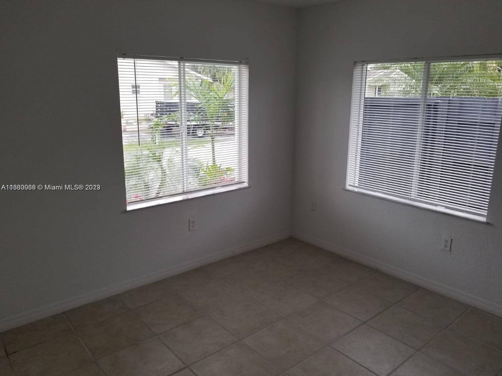 13622 Southwest 285th Terrace Homestead, FL 33033 - Photo 16 of 28 an empty room with a window